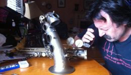 My dad looking at gunk with a microscope